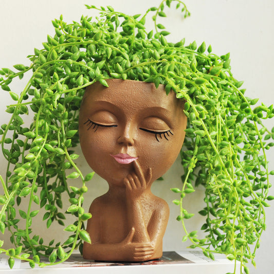 フェイスプランター 頬杖ポーズの女性顔型レジン植木鉢（ブラウン・10x10x17cm）